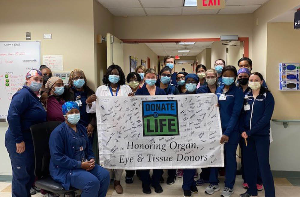 Presby staff on Cupp 4 East pose with the Donate Life banner